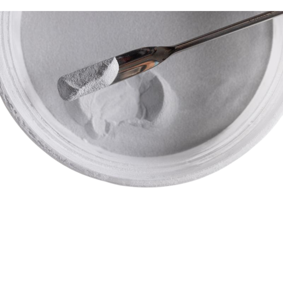 Bowl filled with white polymer powder.
