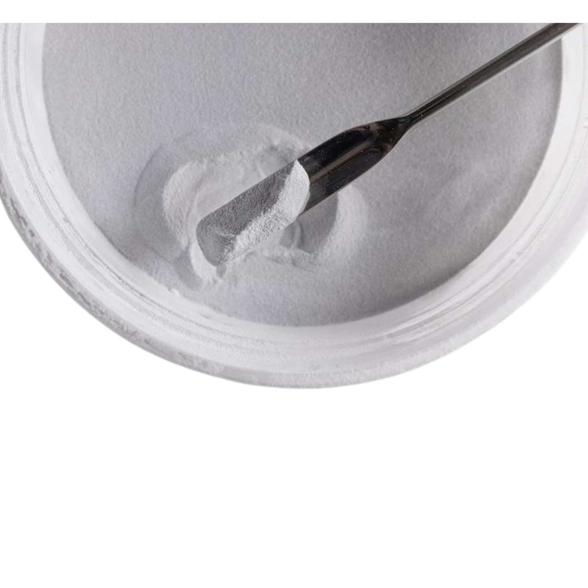 Bowl filled with white polymer powder.