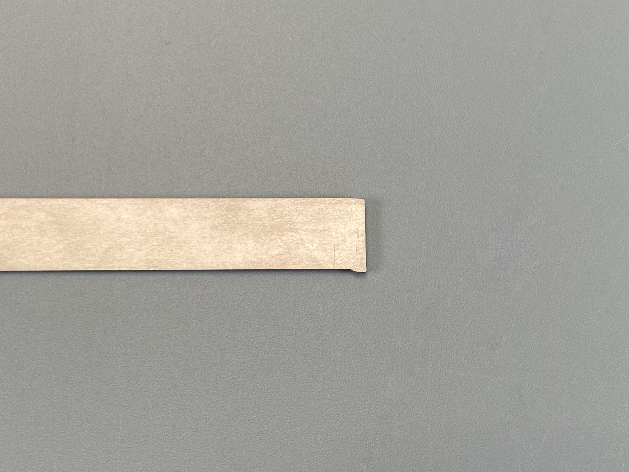 Beige protective strip.