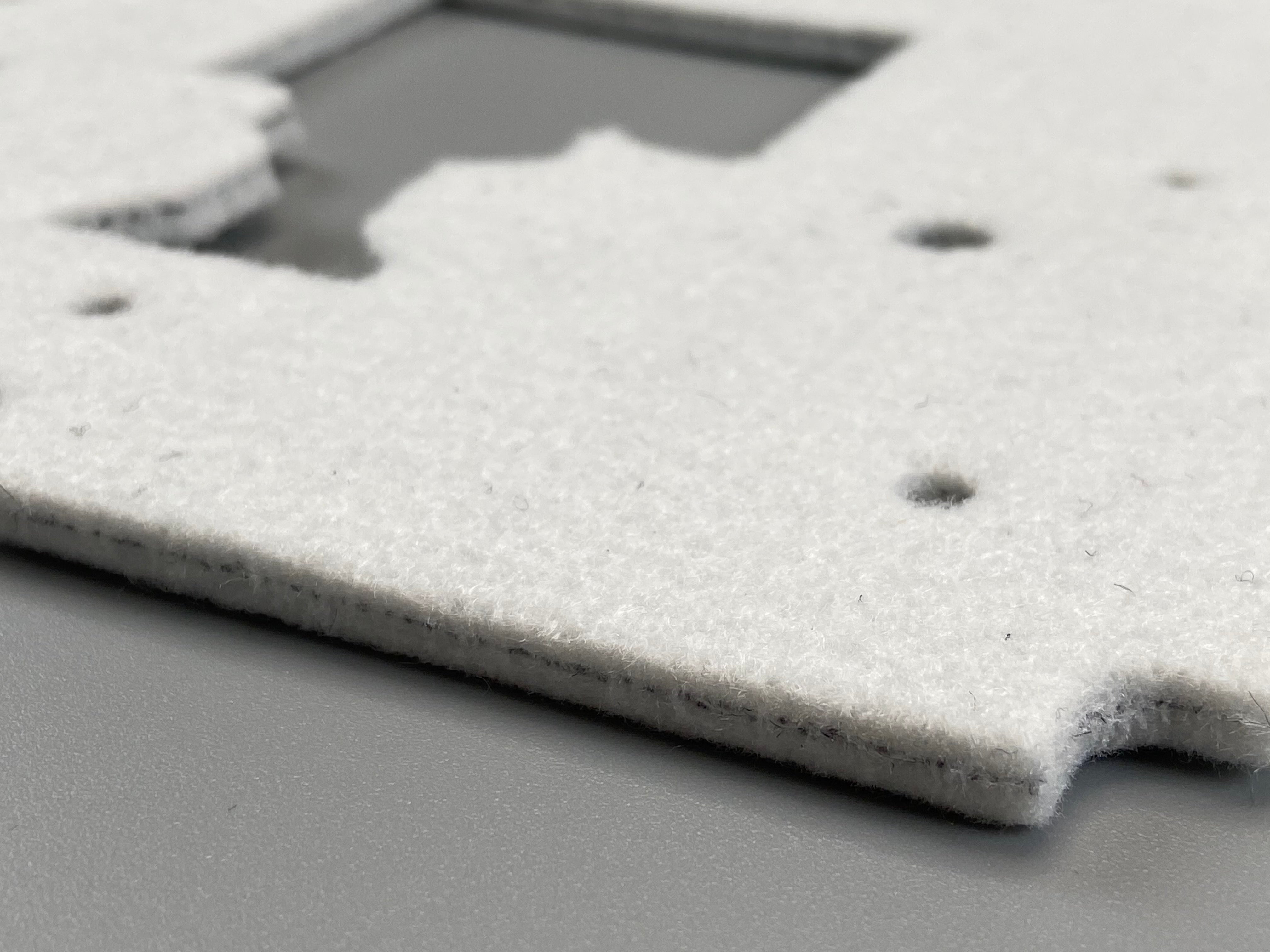 Side view of a white Z-Axis seal.