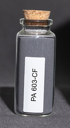 Glass bottle filled with dark gray polymer powder.