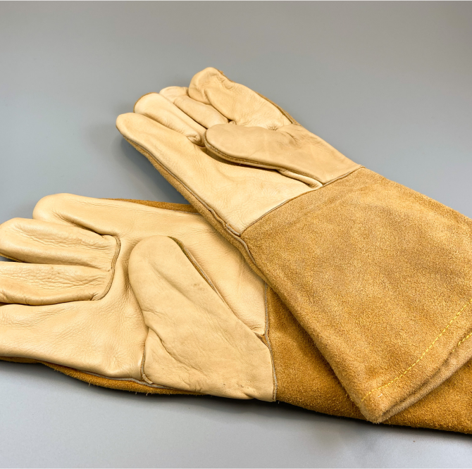 A pair of brown welding gloves.