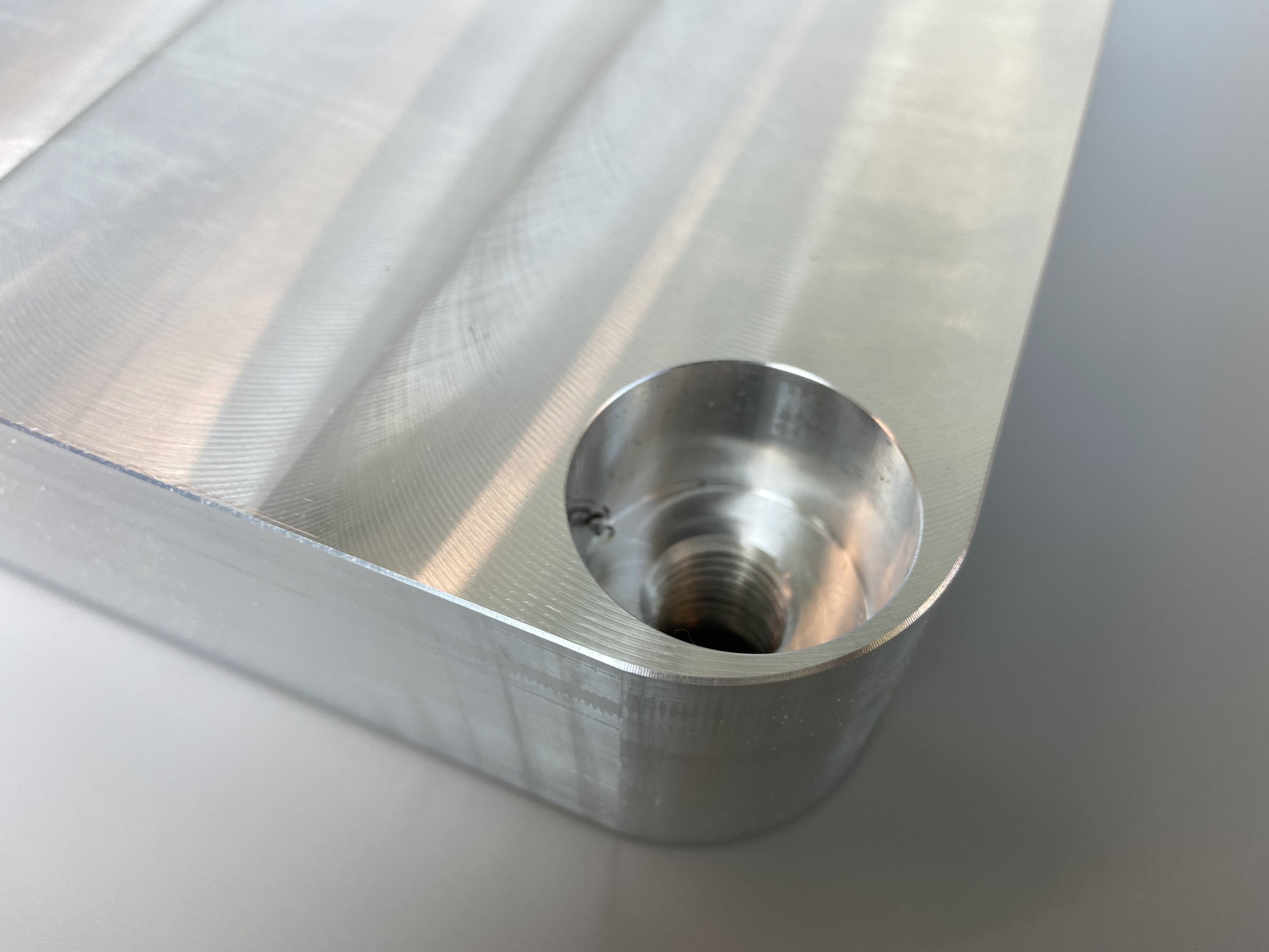 The edge of a rectangular aluminium building platform.