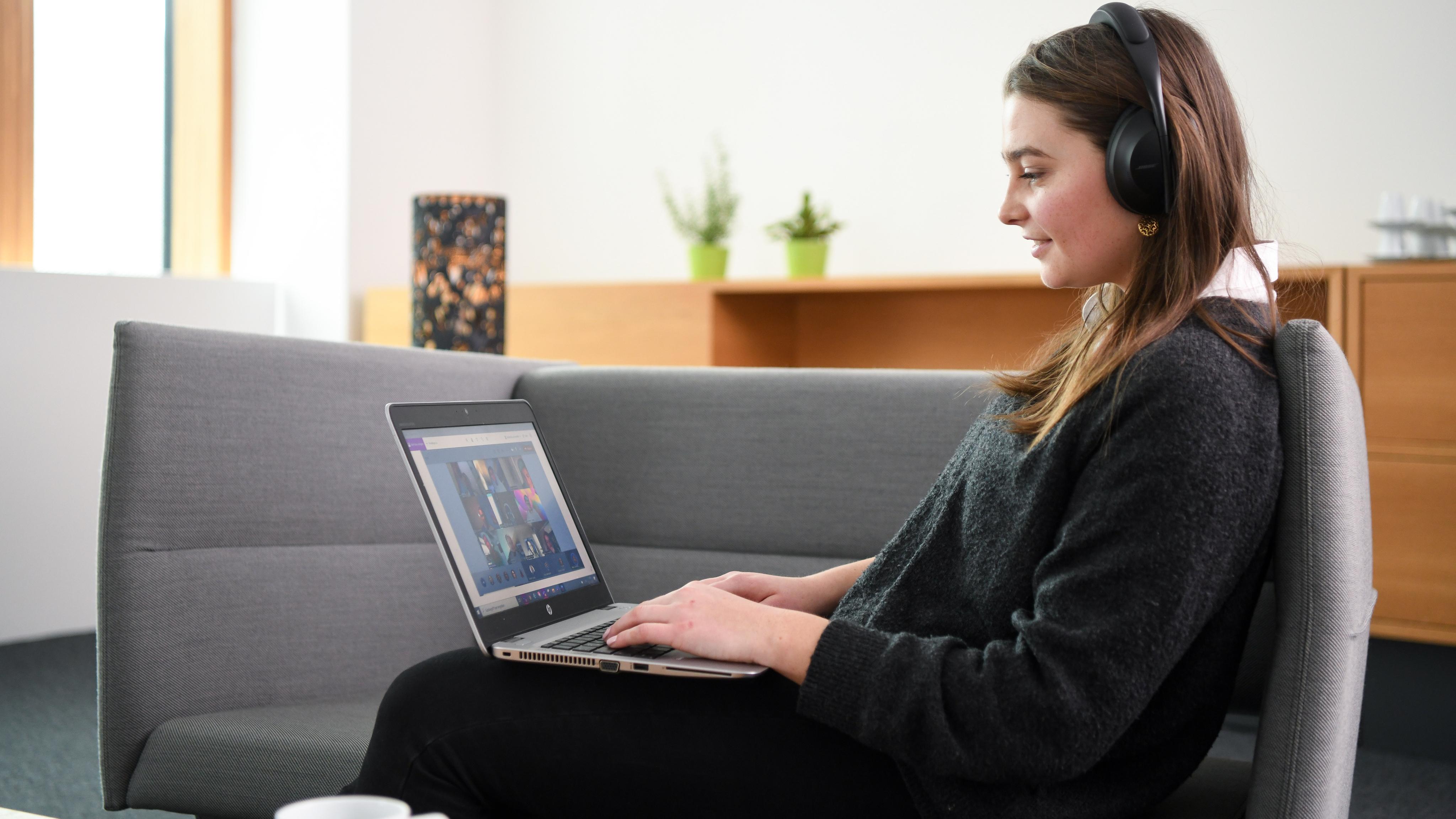 photo of woman viewing laptop